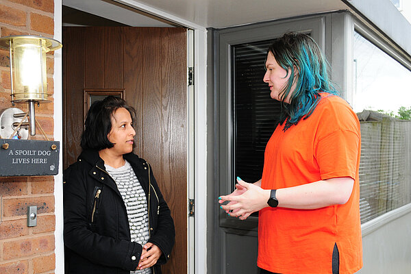 Chris speaking to a resident on the doorstep